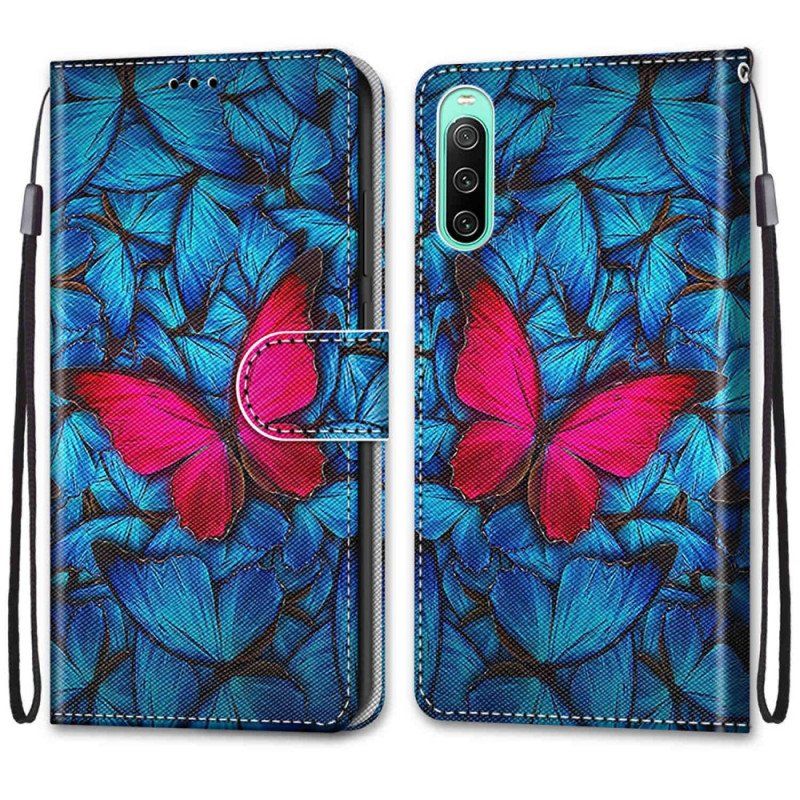 Etui Folio do Sony Xperia 10 IV Czerwony Motyl Niebieskim Tle